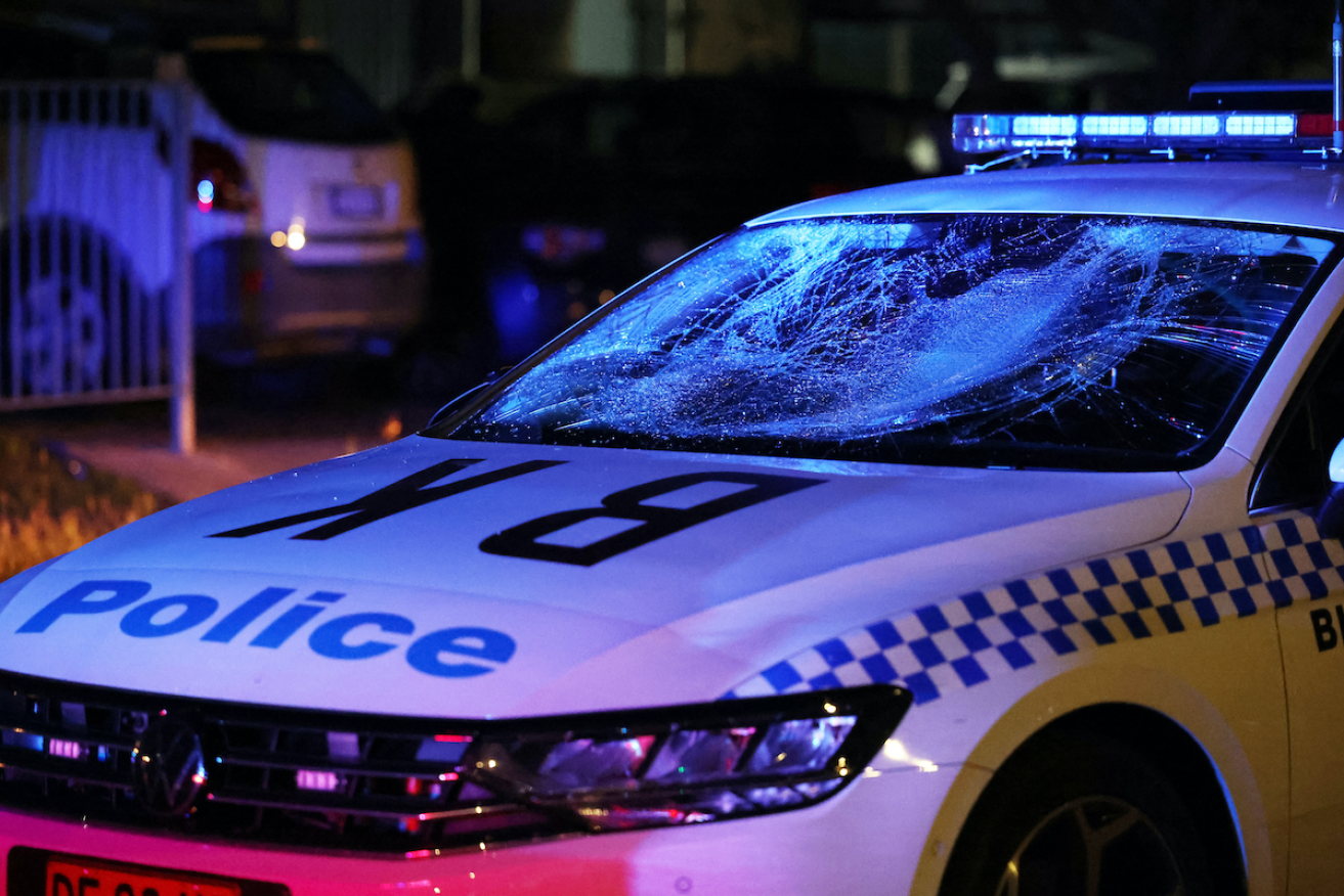Police are still looking for people who attacked police after a stabbing in a Sydney church. Photo: AAP