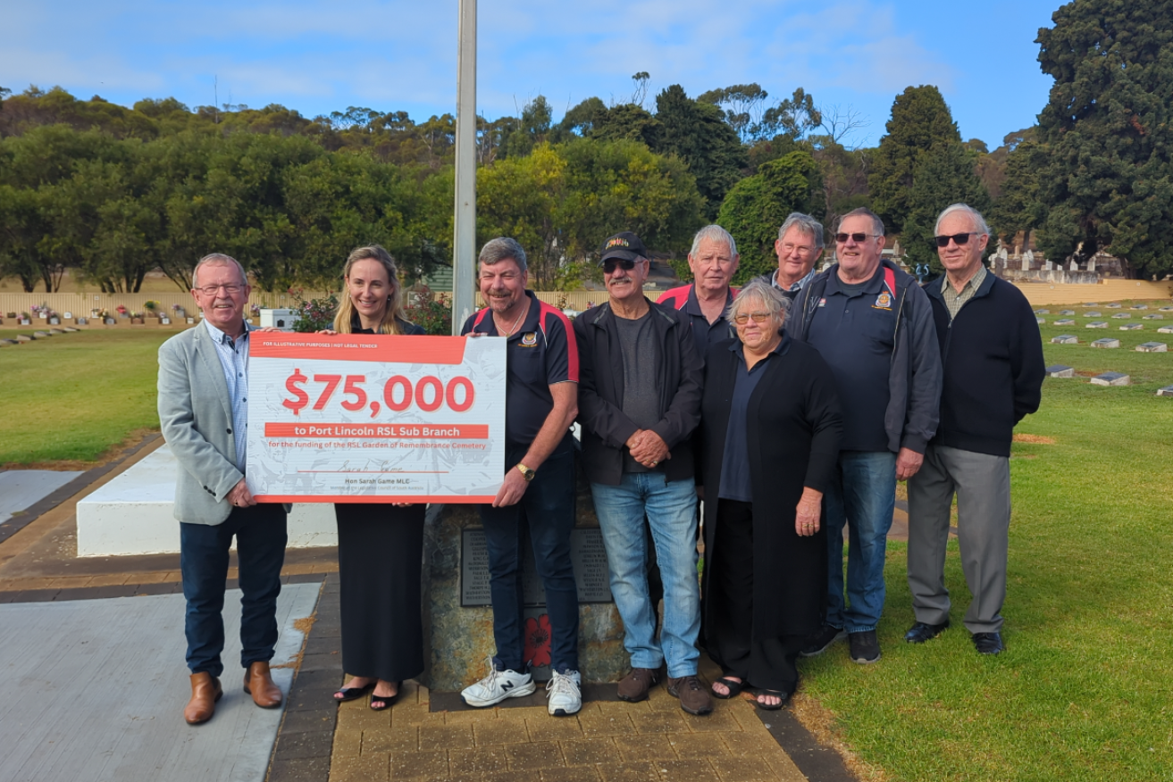 Veterans affairs minister Geoff Brock and Sarah Game delivered funding to the Port Lincoln RSL for maintenance of the veterans' cemetery. Photo: supplied