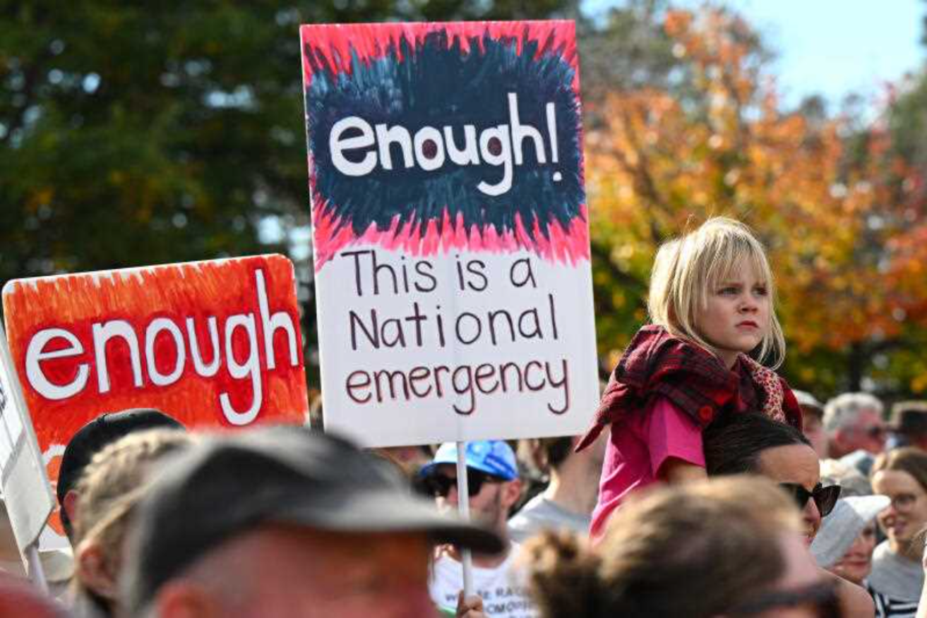 A girl attends a rally to a call for action to end violence against women, in Canberra on Sunday, April 28. Photo: AAP Image/Lukas Coch