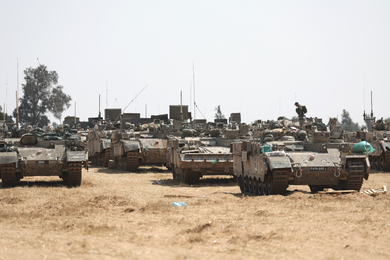 Israeli military vehicles at the southern Gaza strip border near Rafah on Wednesday. Photo: ATEF SAFADI/EPA
