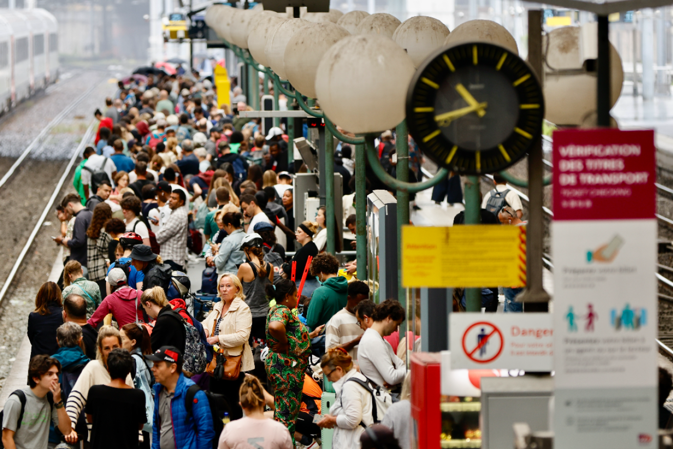 Stranded passengers wait inside Gare du Nord station in Paris after France's high speed rail network was severely disrupted by a series of attacks. Photo: EPA 